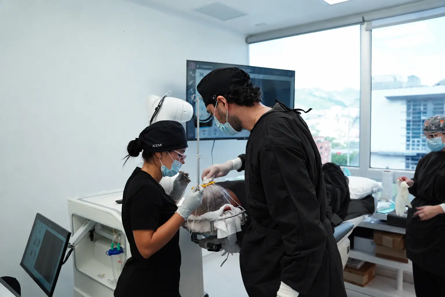 Dharma Hair medical team with a patient during a hair transplant in Medellín